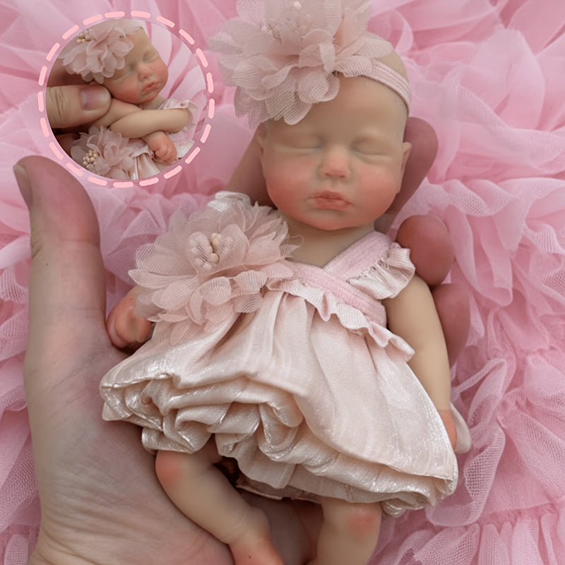Bambola reborn Loulou in silicone 15cm occhi chiusi bambina con vestito rosa