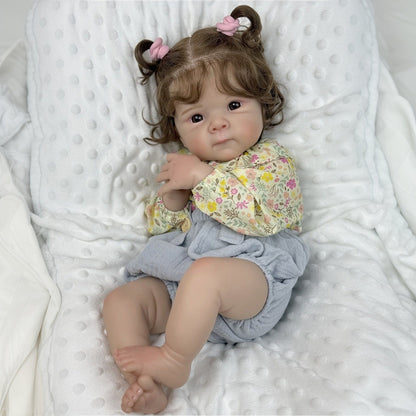 Bambola Reborn Bettie da 48 cm con occhi aperti e corpo morbido in abiti floreali