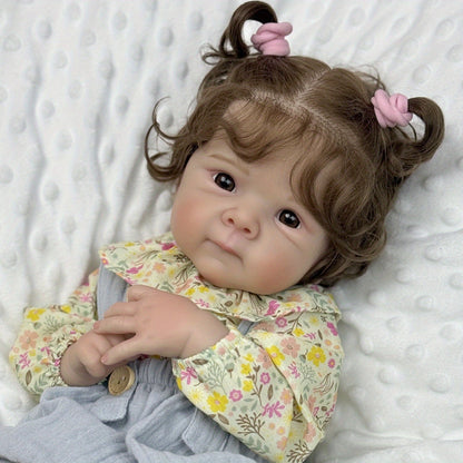 Bambola Reborn Bettie da 48 cm con occhi aperti e corpo morbido in abiti floreali