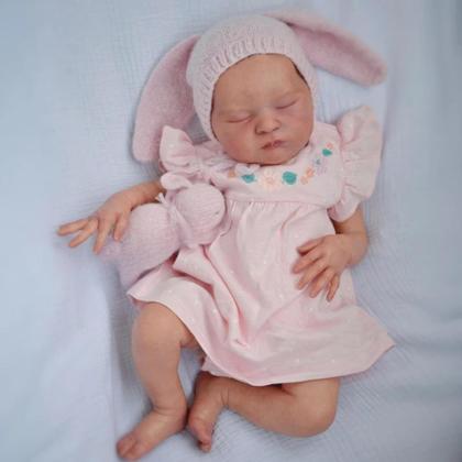 Bambola reborn Laura da 50 cm con corpo morbido e vestito rosa