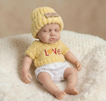 Loulou Bambina rinata in silicone da 20 cm con maglione giallo