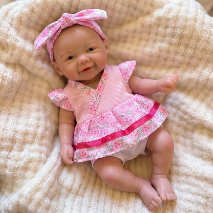 Bambola Reborn Vivienne da 20 cm in silicone pieno femminuccia con vestitino a fiori rosa
