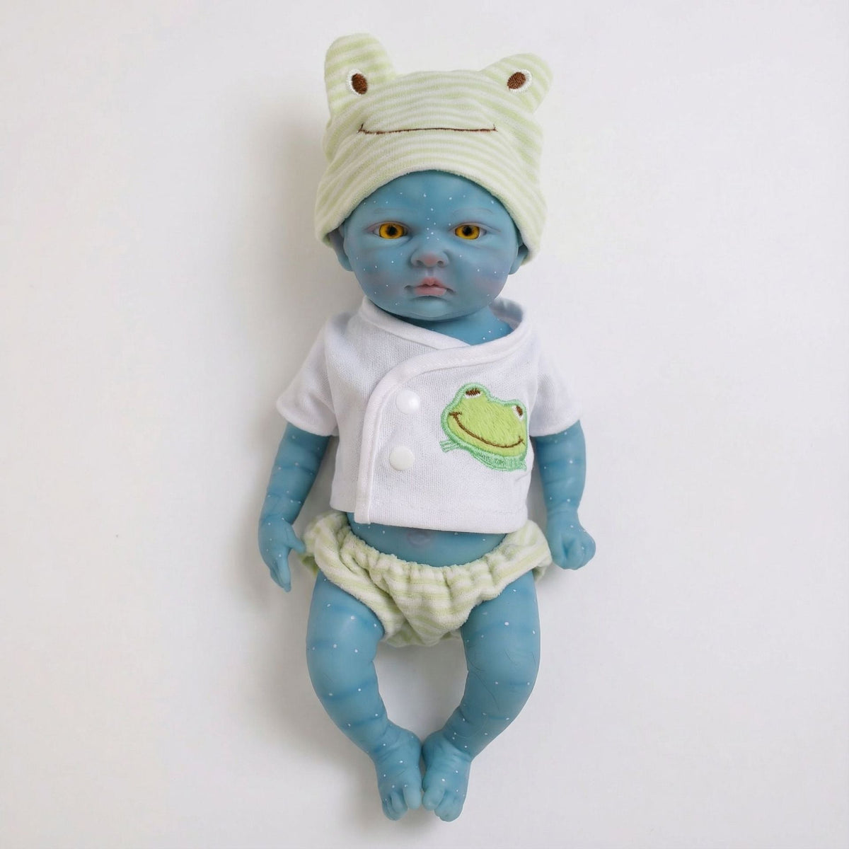 Bambina Reborn Avatar da 30 cm in silicone pieno con completino da rana verde