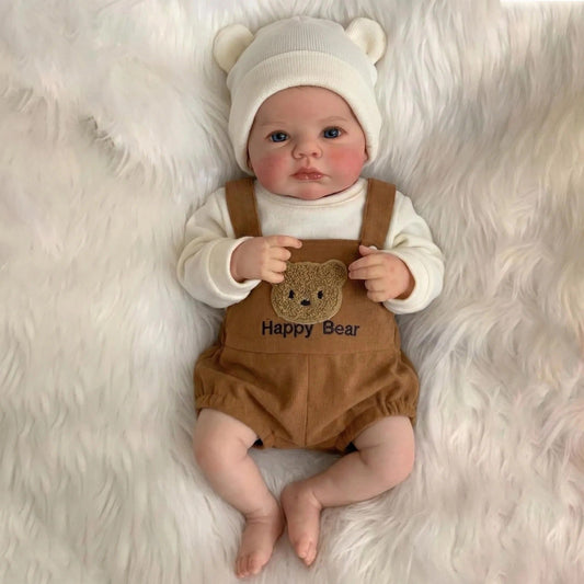 Bambola reborn Loulou dagli occhi azzurri alta 48 cm vestita da orsetto bruno