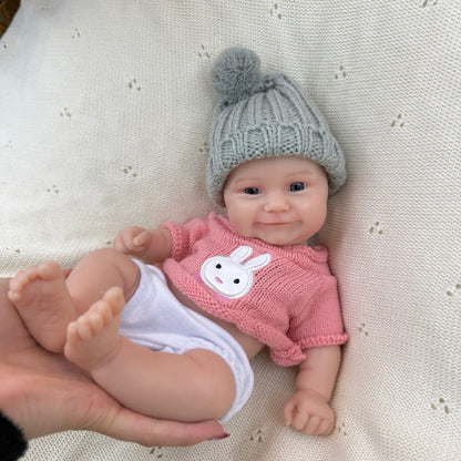 Bambola reborn Maddie da 30 cm in silicone vestita di rosa