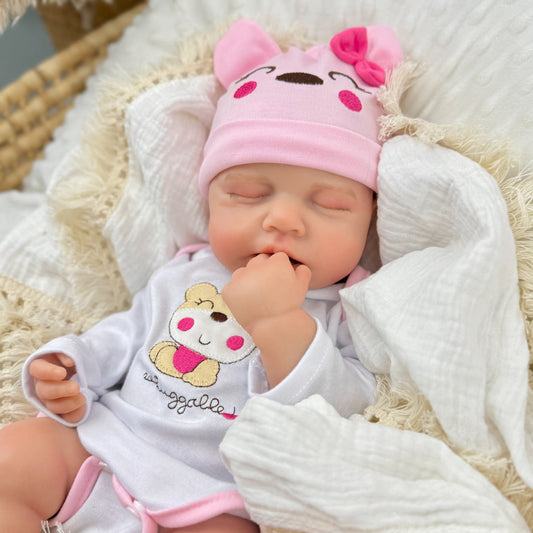 Bambola reborn Loulou alta 45 cm interamente in silicone estensibile con vestitino da orsetto rosa