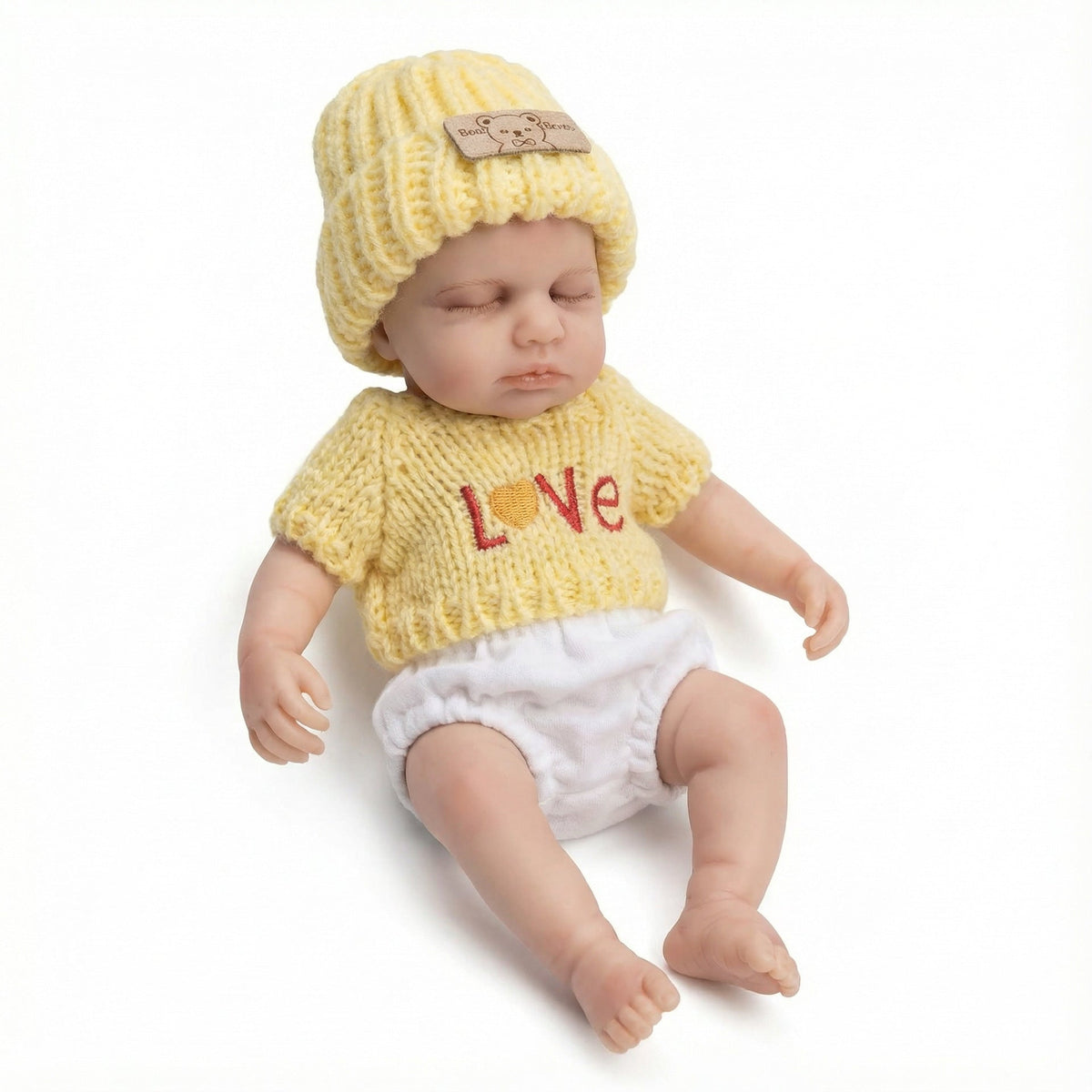 Loulou Bambina rinata in silicone da 20 cm con maglione giallo