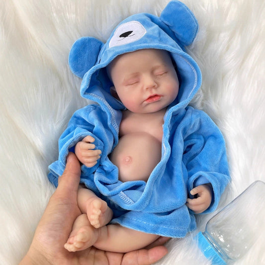 Bambola reborn Loulou addormentata in silicone realistico da 30 cm in accappatoio blu