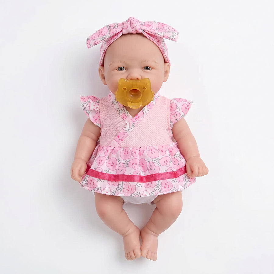 Bambola Reborn Vivienne da 20 cm in silicone pieno femminuccia con vestitino a fiori rosa