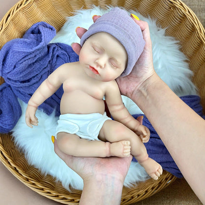 Bambola reborn realistica da 30 cm completamente in silicone addormentata con abiti viola