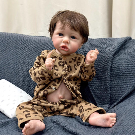Saskia Bambola Reborn da 22" con occhi aperti e vestiti con stampa leopardata