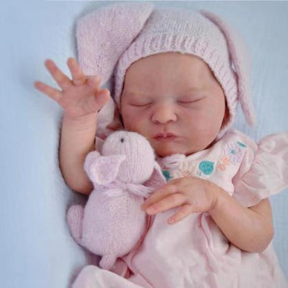 Bambola reborn Laura da 50 cm con corpo morbido e vestito rosa